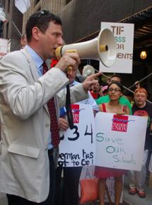 Chicago Teachers Union Vice President Jesse Sharkey speaks at a protest against layoffs
